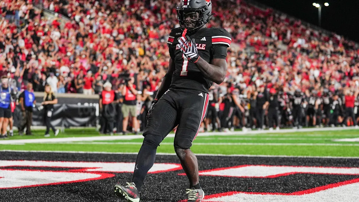 Louisville RB channels grief into performance