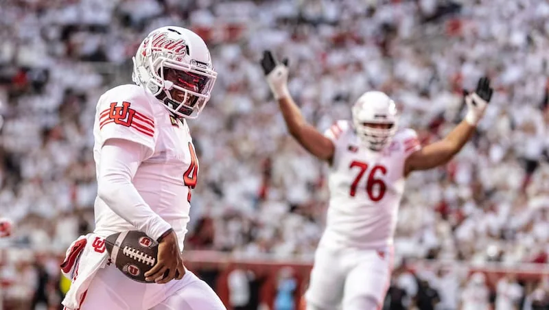 Utah holds off Kansas in fourth quarter to remain perfect