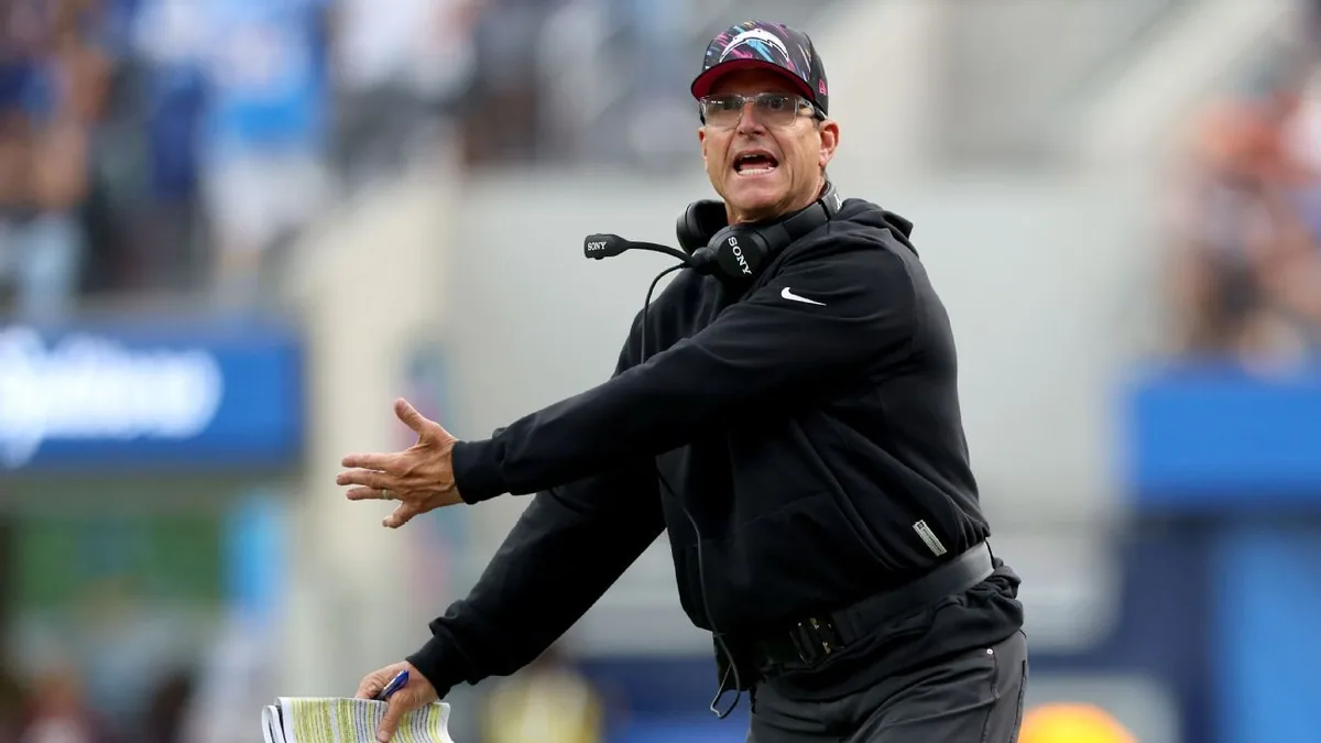 Harbaugh blames call for Chargers' loss to Broncos