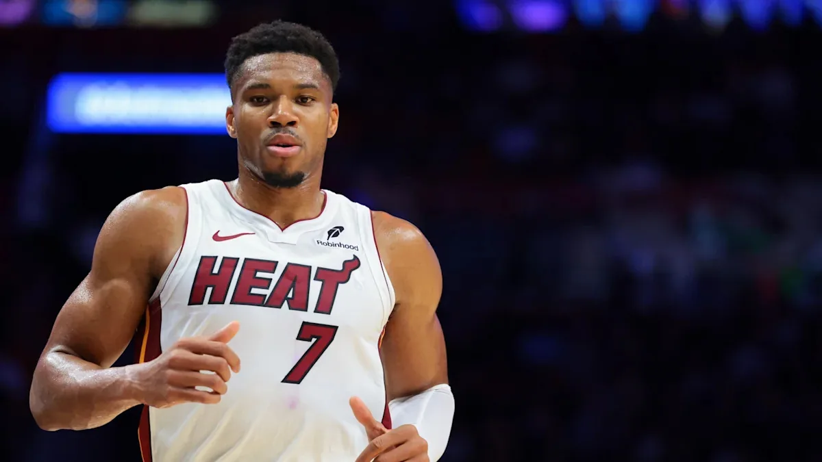 Giannis Antetokounmpo dunks over Miami Heat
