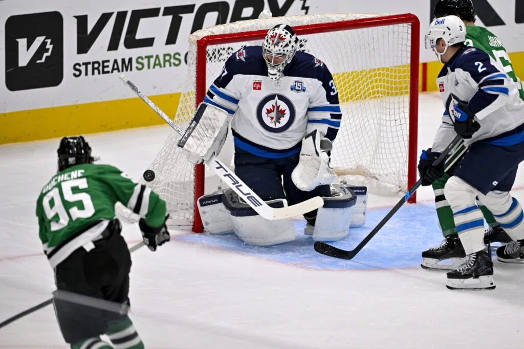 hellebuyck forfeits salary over suspension